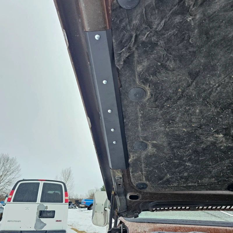 Hood braces shown installed on a 73-80 Chevy squarebody truck hood