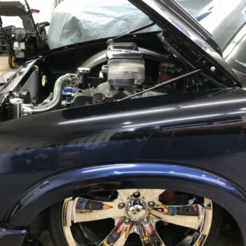 9404 hood strut kit installed on blue chevy truck