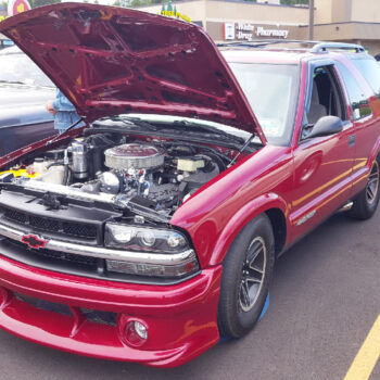 9404 hood strut kit installed on red chevy truck Blazer