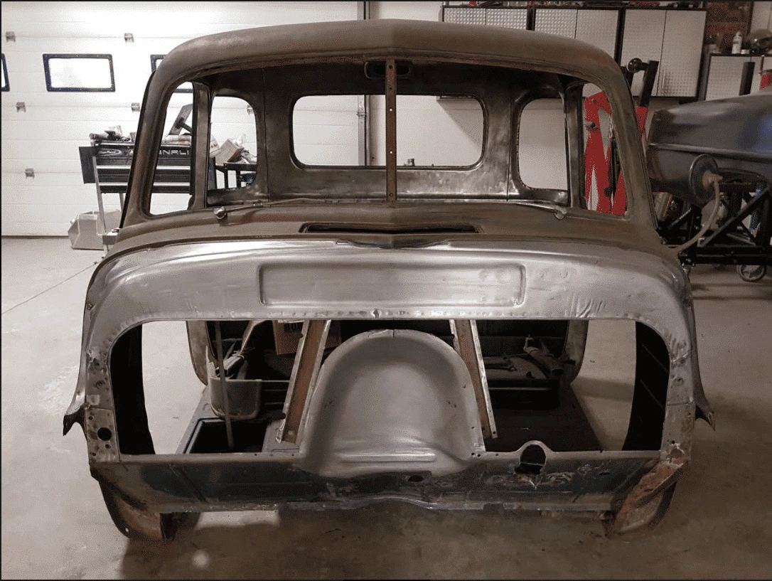 Factory firewall cutout prepared for a 47-54 Chevy truck bead rolled panel