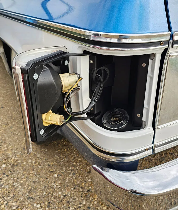 Squarebody fuel filler kit hidden behind the taillight on a 1973-91 Chevy truck bedside