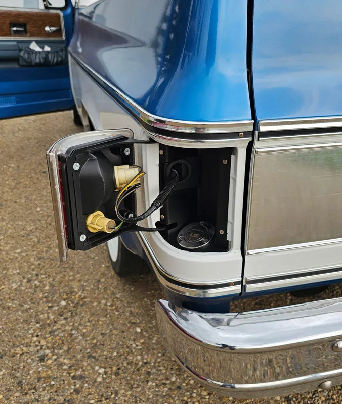 installed chevy taillight fuel filler on a square body truck open