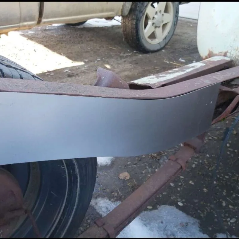 Rear frame boxing plate welded to a GMC Chevy truck frame rail, close-up