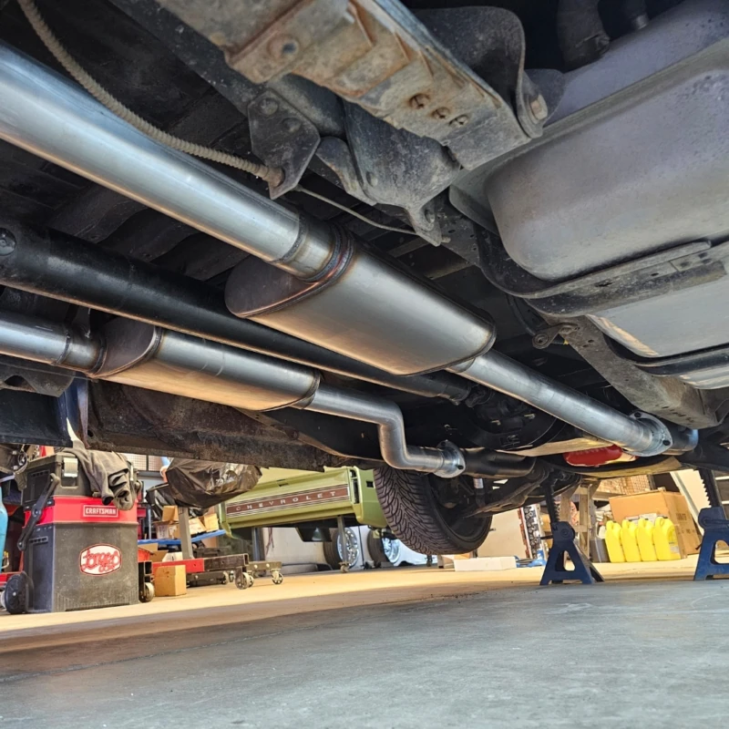 Transmission crossmember bolted in place, underside view