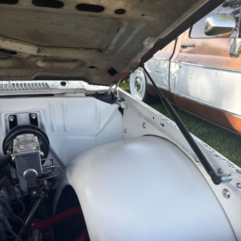 Hood strut kit for 73-87 Chevy squarebody truck, hardware laid out
