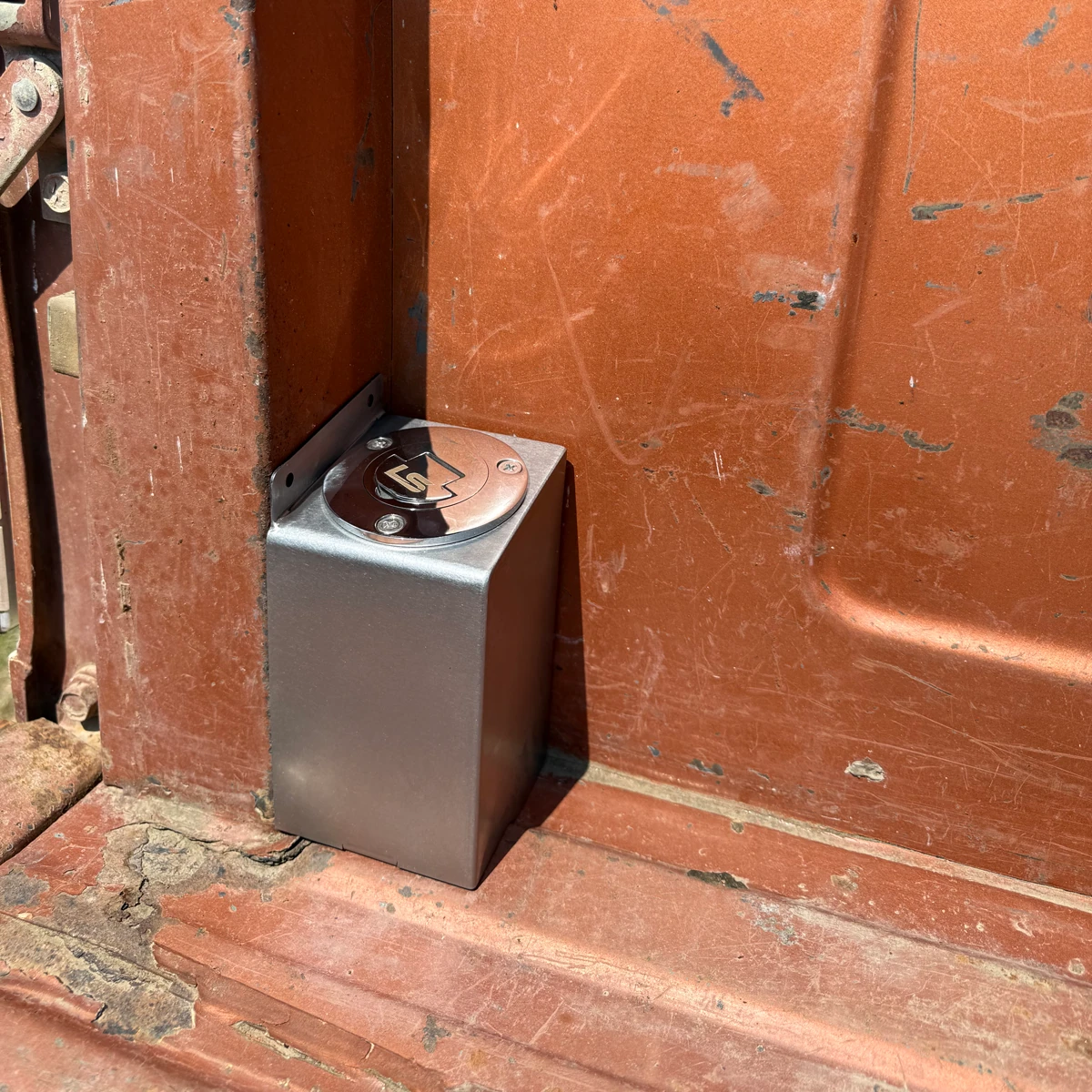 Inside box panel fuel filler shown installed in a truck bedside, angle view