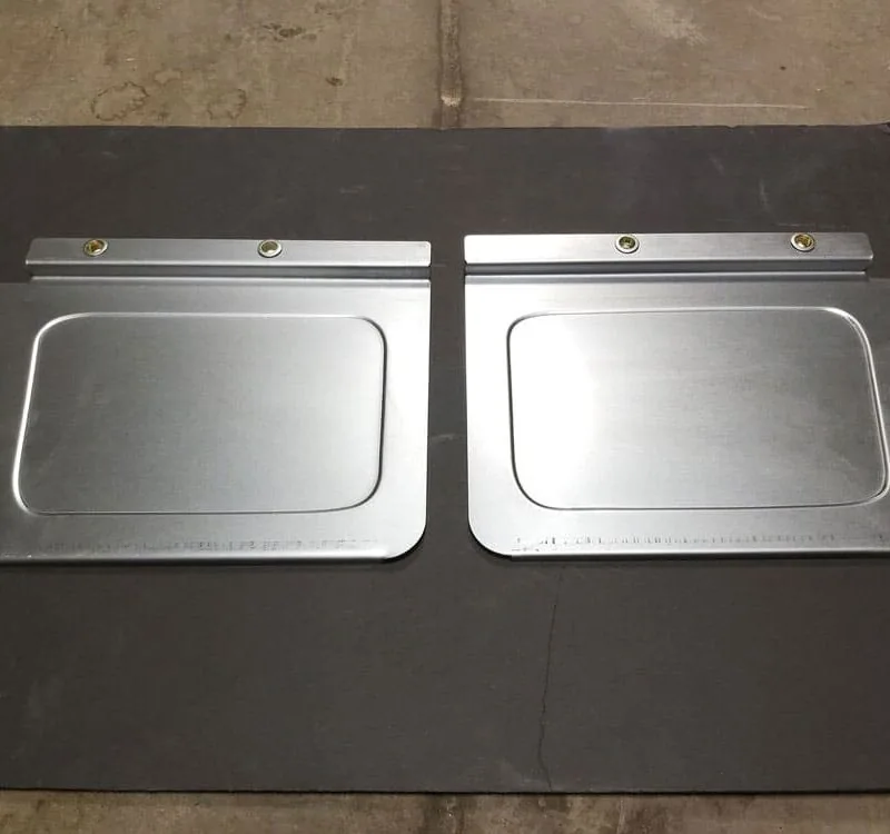 Stone guards shielding the crossmembers of a 73-87 Chevy squarebody truck