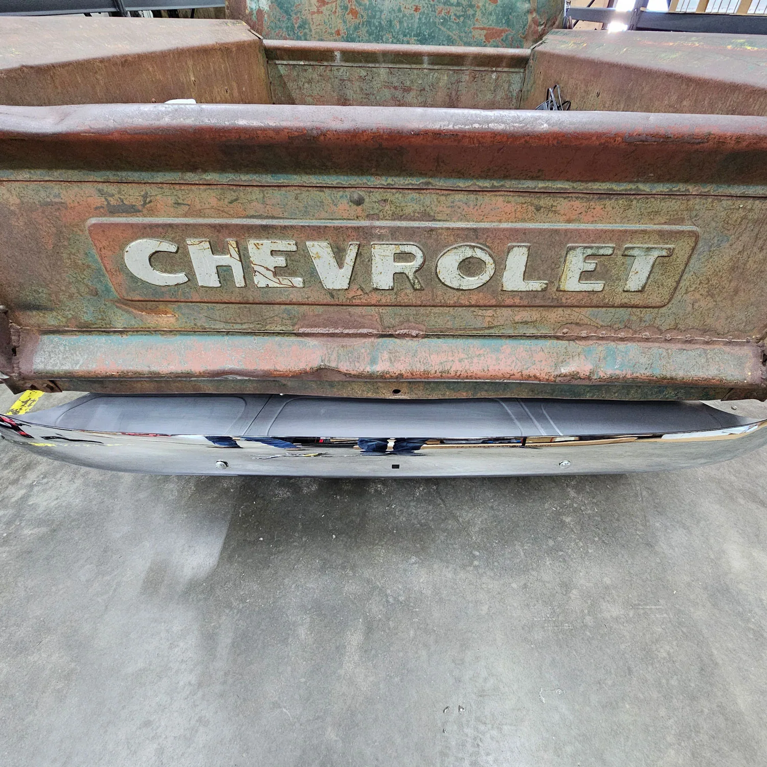 Tucked bumper bracket with filler panels installed on an Advance Design truck