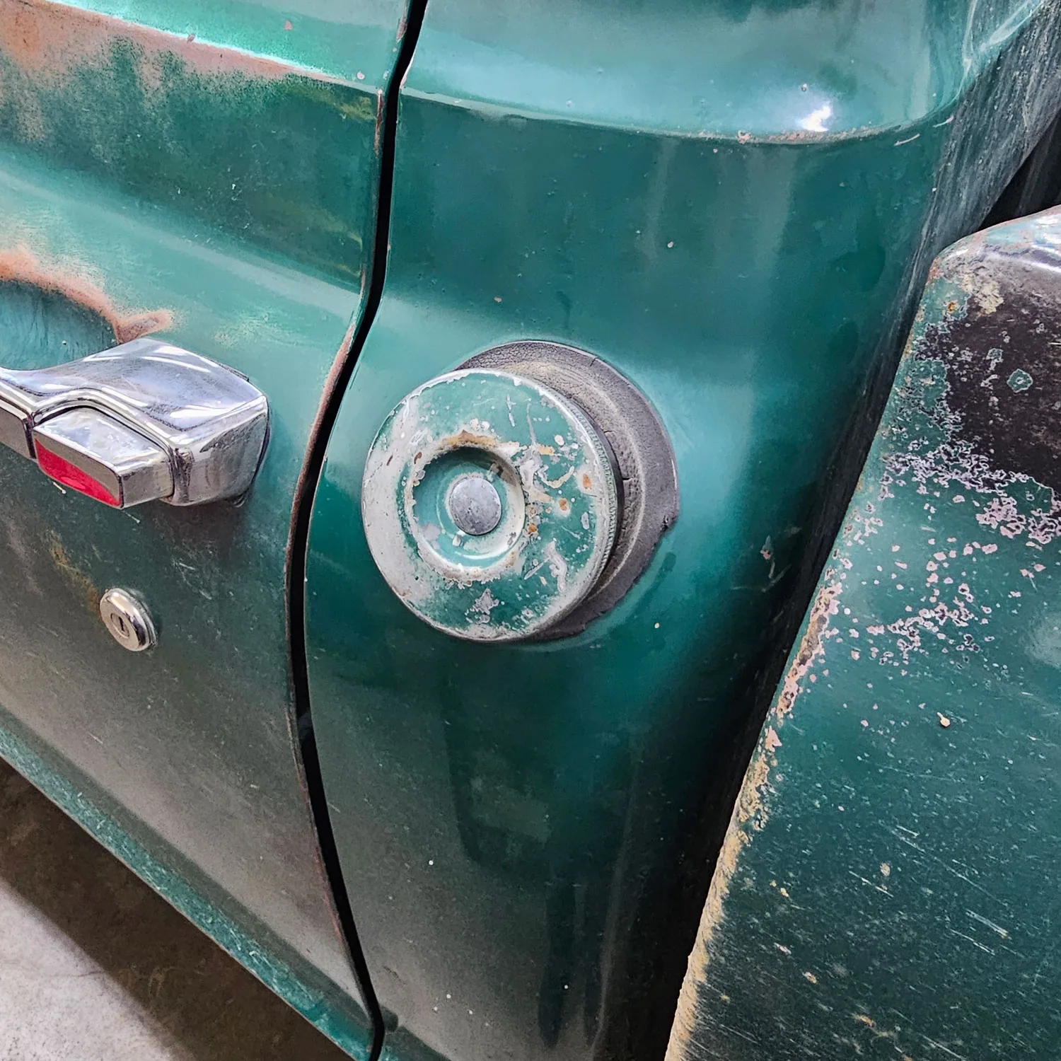 Trickle charge adapter built into a fuel filler relocation kit