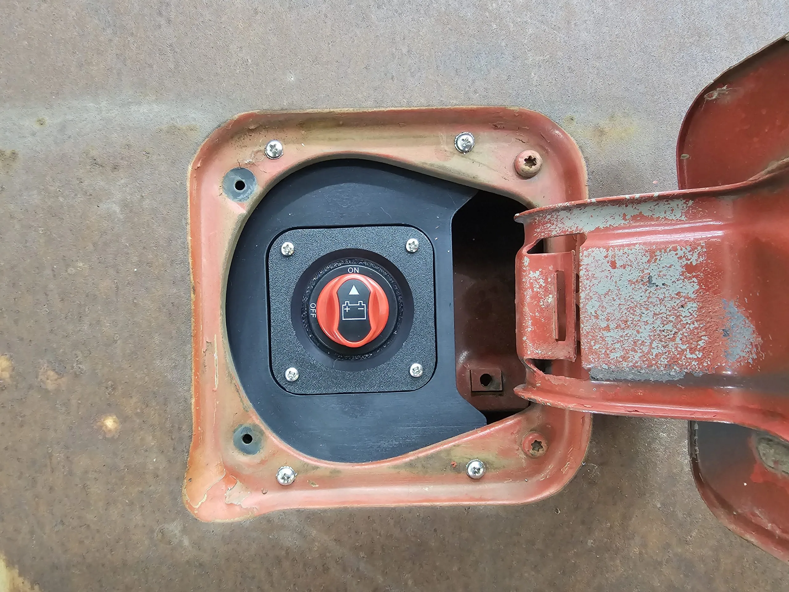 Charger port housing that replaces the factory fuel filler on a 77-91 GMC Chevy truck