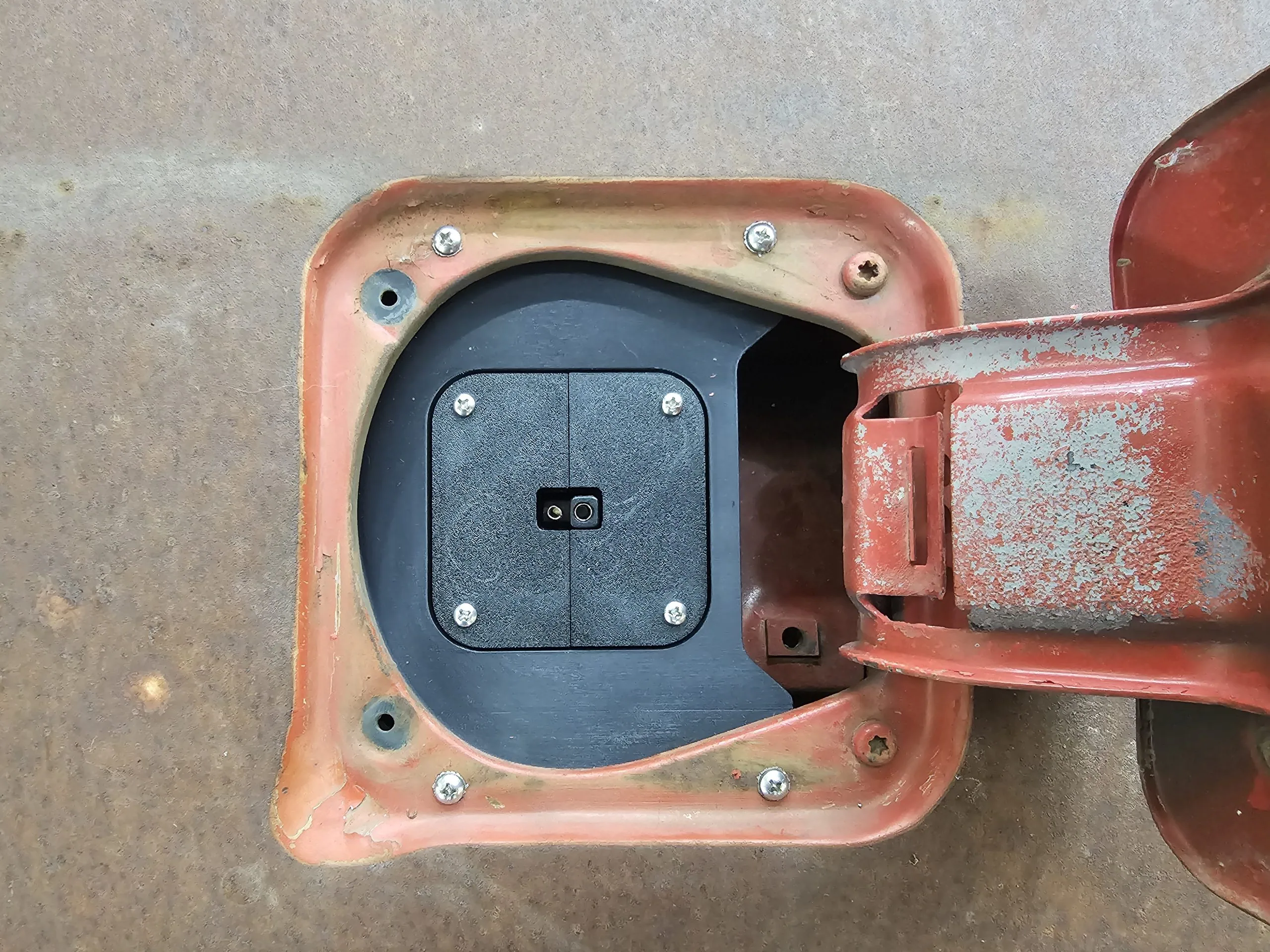 Kill switch port mounted in the bed side fuel filler opening of a squarebody truck