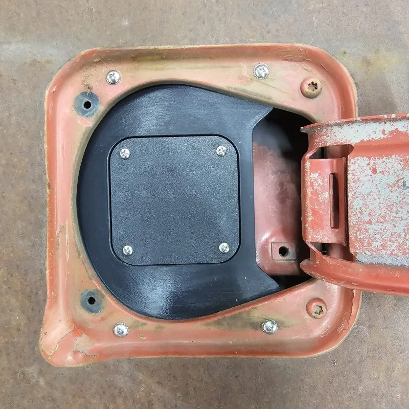 Fuel filler charger port shown installed on a 77-91 GMC Chevy squarebody truck